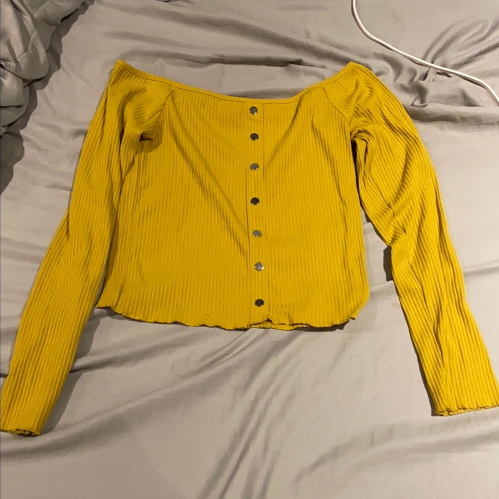 A gold off the shoulder top